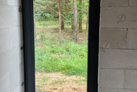 Brama garażowa UniTherm, okna PVC PRIMO 82, rolety Protecta P