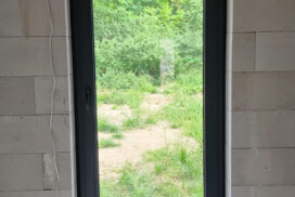 Brama garażowa UniTherm, okna PVC PRIMO 82, rolety Protecta P